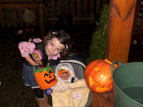 Clara and Isabelle O' Keeffe produly showing their winning pumkin that they grew weighing in at 10kg at the Secret Garden, Newmarket