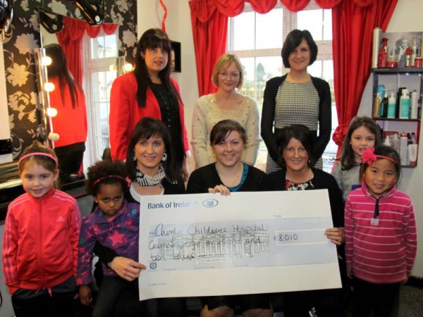Patsy O Leary of Patsy's Style Options, Cullen, and Mary Byrne presenting a Cheque for €8,010, to Ann Marie O Flaherty of Our Lady's Hospital, Crumlin,  proceeds from the Style Coaching Evening they ran last November. Also included are Emma Byrne, Mahilet O Leary, Maeve Byrne, Vy-Ha O Leary, Sheila Lucey, Kate McAuliffe, and Eithne Cremin. Photo by Sheila Fitzgerald.