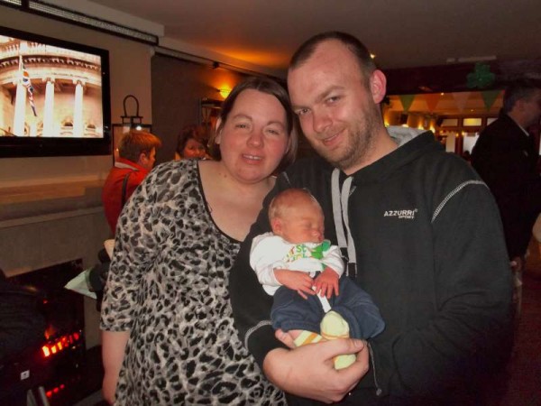 Twelve day old Lukas McCormack pictured with Mum and Dad was the youngest spectator at today's superb St. Patrick's Day Parade 2013.  The Kelleher Family enjoyed viewing the excellent Parade as it passed Minor Row.   Lots more pictures tomorrow.   (S.R.)