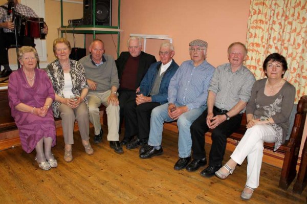 On Sunday night in the very welcoming setting of Ballydaly Hall a special night of wonderful music, singing, refreshments and chat was held in honour of the superbly inspiring Fr. Con Kiely presently at home in his beloved Ballydaly from his splendid missionary work in South America.  Here we see Fr. Con with musician supreme, Pat Joe O'Leary and with some of the many relatives and friends in attendance on Sunday night.  (S.R.)