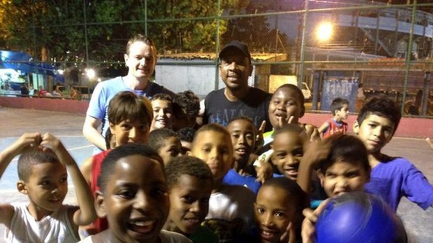 2014-06-10 Conor Hartnett with Carlao and kids at their concrete pitch in Rio