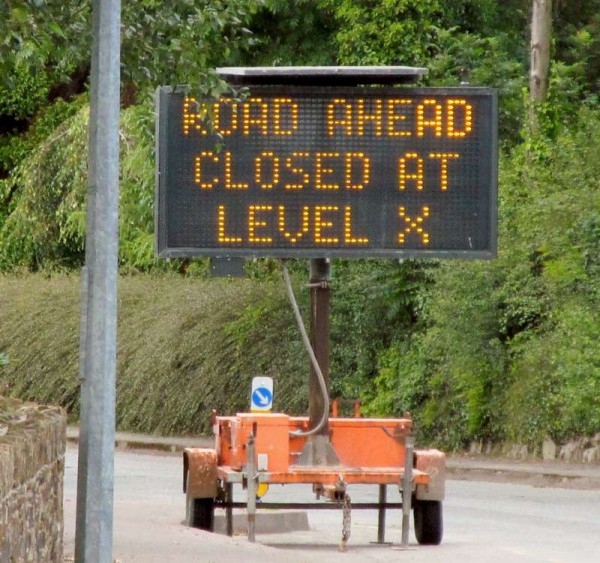 This road sign on Station Road, Millstreet alerts us to the fact that the road at Millstreet Railway Station Level Crossing will be closed from Tuesday, 19th at 10 a.m. until Friday 22nd August at 3 p.m..  Click on the images to enlarge.  (S.R.)