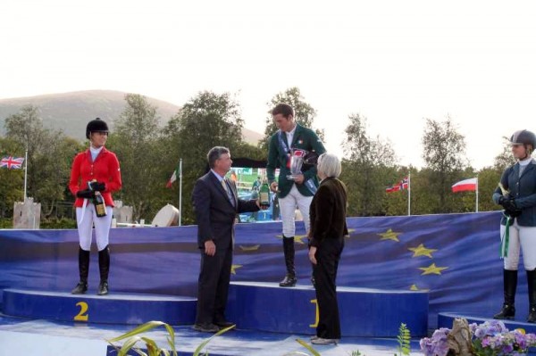 Judge Neil O'Connor (West End, Millstreet and USA) presents the celebratory bottle to Millstreet Grand Prix Winner 2014 Thomas Ryan from Tipperary at the superbly successful Millstreet International Horse Show at Green Glens on Sunday, 17th August.  Thomas (below) kindly signs his autograph for Millstreet Museum.  Click on the images to enlarge.  (S.R.)