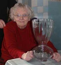 2009 - Dola O'Byrne with her award for the best window display at Millstreet's St. Patrick's Day Parade