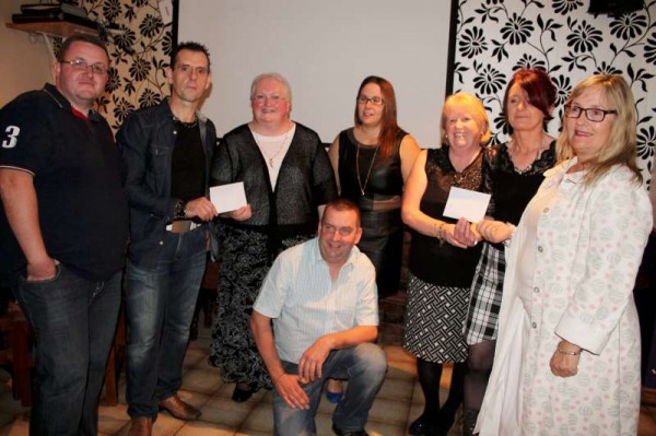 The wonderfully uplifting result of the recent annual Carriganima Fundraising Walk saw the presentation at The Pub in Carriganima on Saturday, 11th Oct. 2014 of €1,000.00 to both Millstreet & Macroom Hospitals.  From left: Jimmy Murphy, Matron Lena Kelleher (Millstreet), Margaret Pierce, Marie Good, Ann Marie Murphy, Matron Bernie Buckley and in front a further member of the Organising Committee, Seán Murphy.  Click on the images to enlarge.  (S.R.)