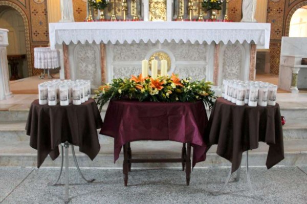 Special Candles of Remembrance (each indivually inscribed with the name of the person who would have passed to their Eternal Reward ove the past year) are now in place by Parish Secretary, Sharon Lane, in advance of the 6.30pm Mass of Remembrance this evening.   Forty-five names are remembered in the very beautiful November Garden.   The design of the graphic display is by Declan Crowley of Milltech.  Care of the Garden by Sharon, Julie and Canon John.  (S.R.)