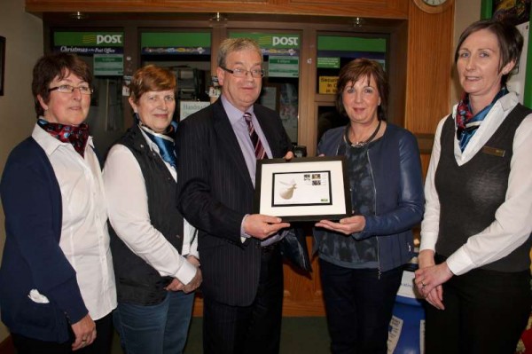 Presentation by Frank Curtin to Patricia of the three official Irish Christmas Stamps.  Also included are the wonderfully dedicated Staff of Millstreet Post Office - from left:  Ann, Noreen, Patricia and Margaret.