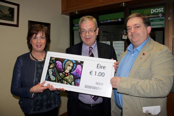 At the Millstreet Launch of the Bill Power An Post Millstreet Stamp on 1st Dec. 2014.  From left: Patricia Moynihan (Post Mistress), Frank Curtin (An Post, Cork GPO) and Bill Power, Photographer of the renowned Christmas Stamp 2014.   An amazing 3.7 million Millstreet Stamps have now been sold and have gone worldwide.  Click on the image to enlarge.  (S.R.)