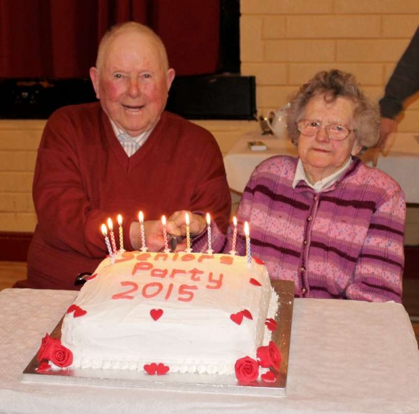 Cutting the cake as the most senior Guests at the annual Seniors' Party held at Dromtariffe Community Hall on Sunday, 15th February 2015....Denis O'Leary of Coolclogher who is in his 90th year and Julia Duggan of Dromagh who is 94 years young.  Click on the images to enlarge.  (S.R.)