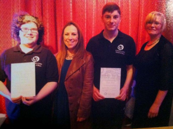 Congratulations to Nora O'Sullivan and Gerard O'Hanlon who recently received a Certificate of Achievement and Commitment from the County Cork School of Music. Their award was for Group Music in the Community 2014. Nora O'Sullivan and Gerard O'Hanlon are pictured with Principal of County Cork School of Music Carol Daly and their teacher Noreen O'Connor.(Photo by Sheila Fitzgerald)  We thank Jim O'Sullivan for the picture and caption.  (S.R.)