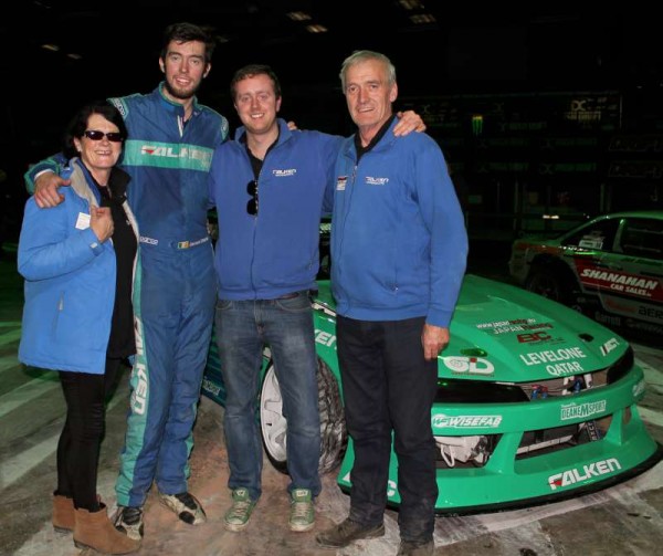 James with his parents and brother.