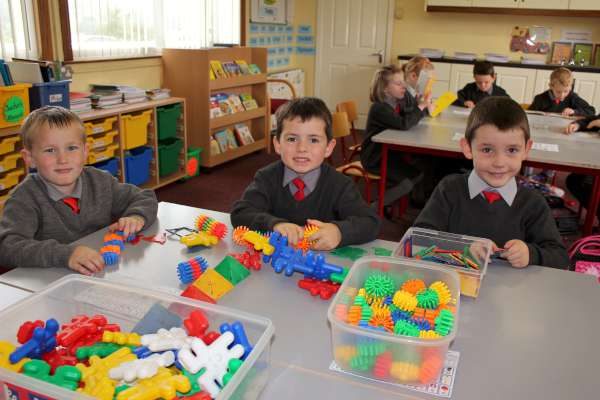 Calvin, Cai and Kevin engrossed in colourful construction activities - building towards the future!  Pictured on their First Day in Junior Infants at Cloghoula N.S., Millstreet.  Below the three boys join with other Pupils and Staff during Break on the bright autumnal morning.  Click on the images to enlarge.  (S.R.)