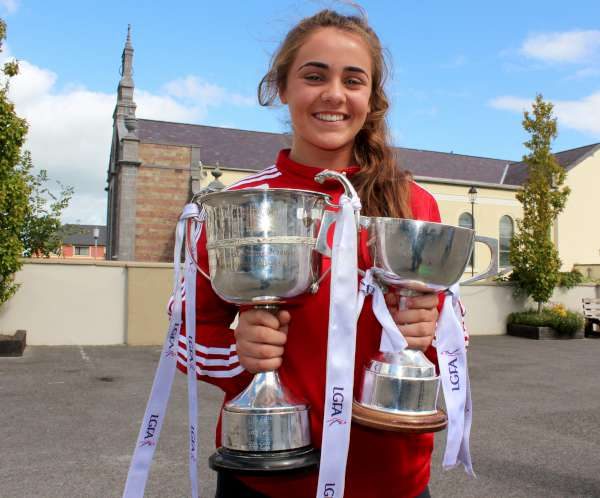 Chloe Collins was one of three Cork All Ireland Minor Football Under 18 Winners 2016 to visit National Schools throughout Duhallow and Sliabh Luachra on Friday, 2nd Sept. 2016. Pictured here with the Munster and All-Ireland Cups at Presentation N.S., Milllstreet. Click on the images to enlarge. (S.R.)